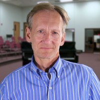 Nathaniel Huggins Man with light brown hair, graying at the temples